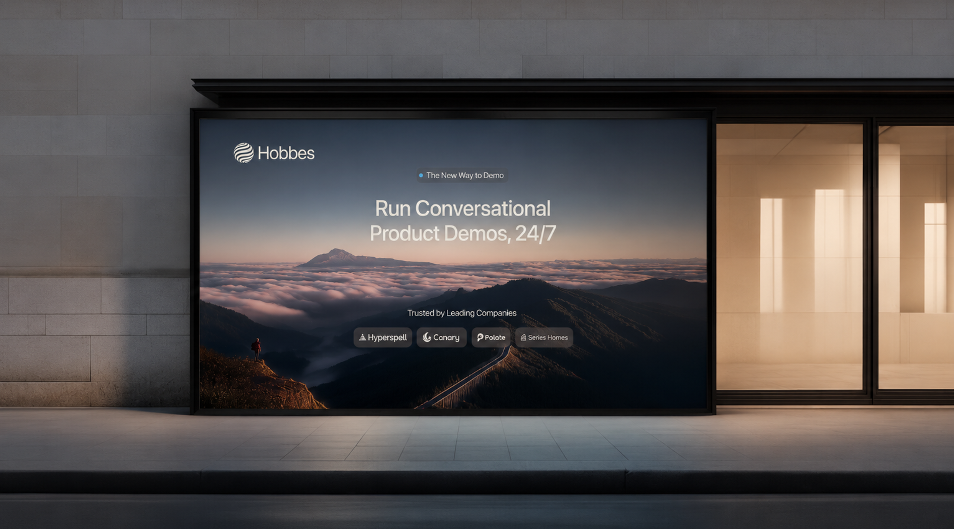 Hobbes billboard in a storefront window: “Run Conversational Product Demos, 24/7” over a sea of clouds