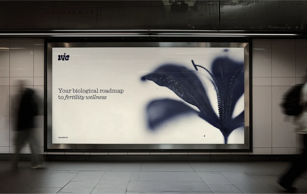 A Billdr app advertisement on a subway platform billboard, showing a construction worker beside the line "Your construction business, in your pocket."