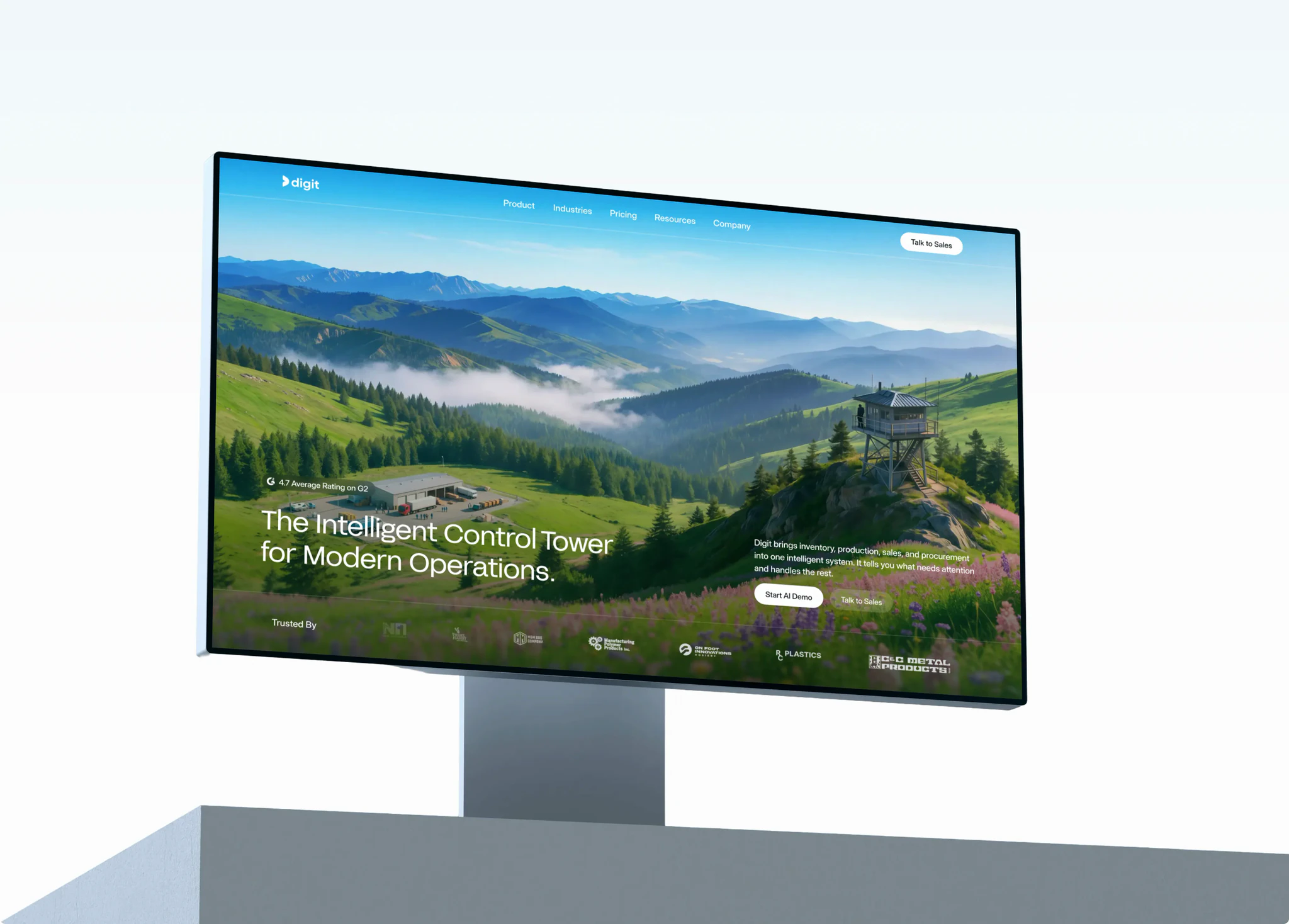 The Digit homepage displayed on a wide desktop monitor, angled on a plinth