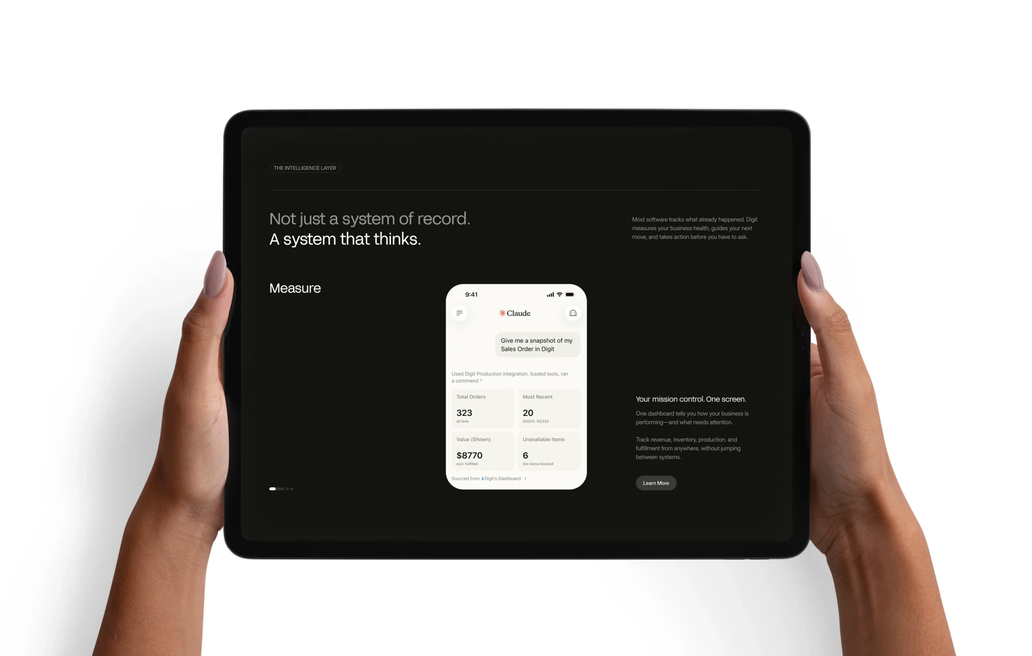 Hands holding a tablet showing Digit's intelligence layer — “Not just a system of record. A system that thinks.”